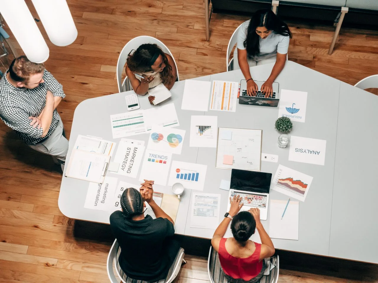 Team of entrepreneurs and marketers collaborating on strategy